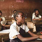 a boy sitting in classroom